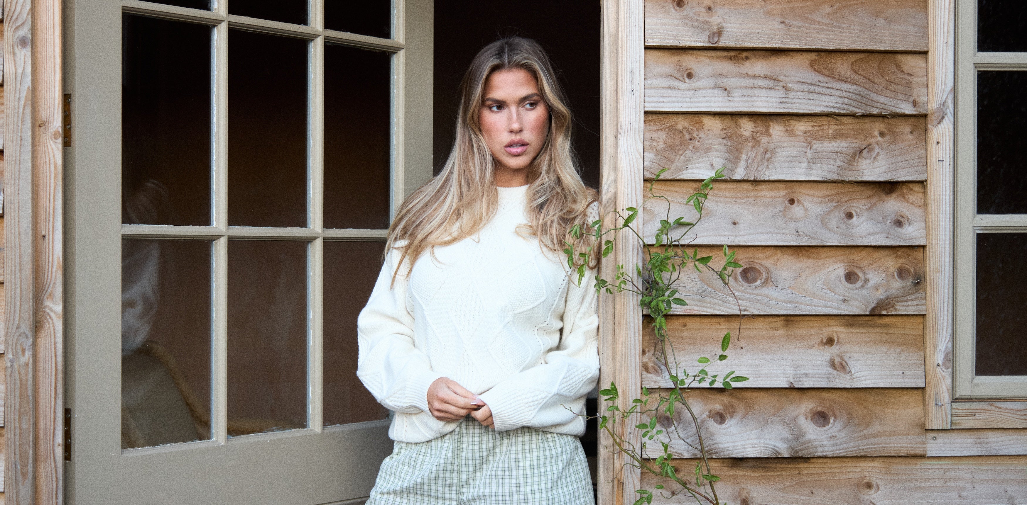 a woman standing in front of a door