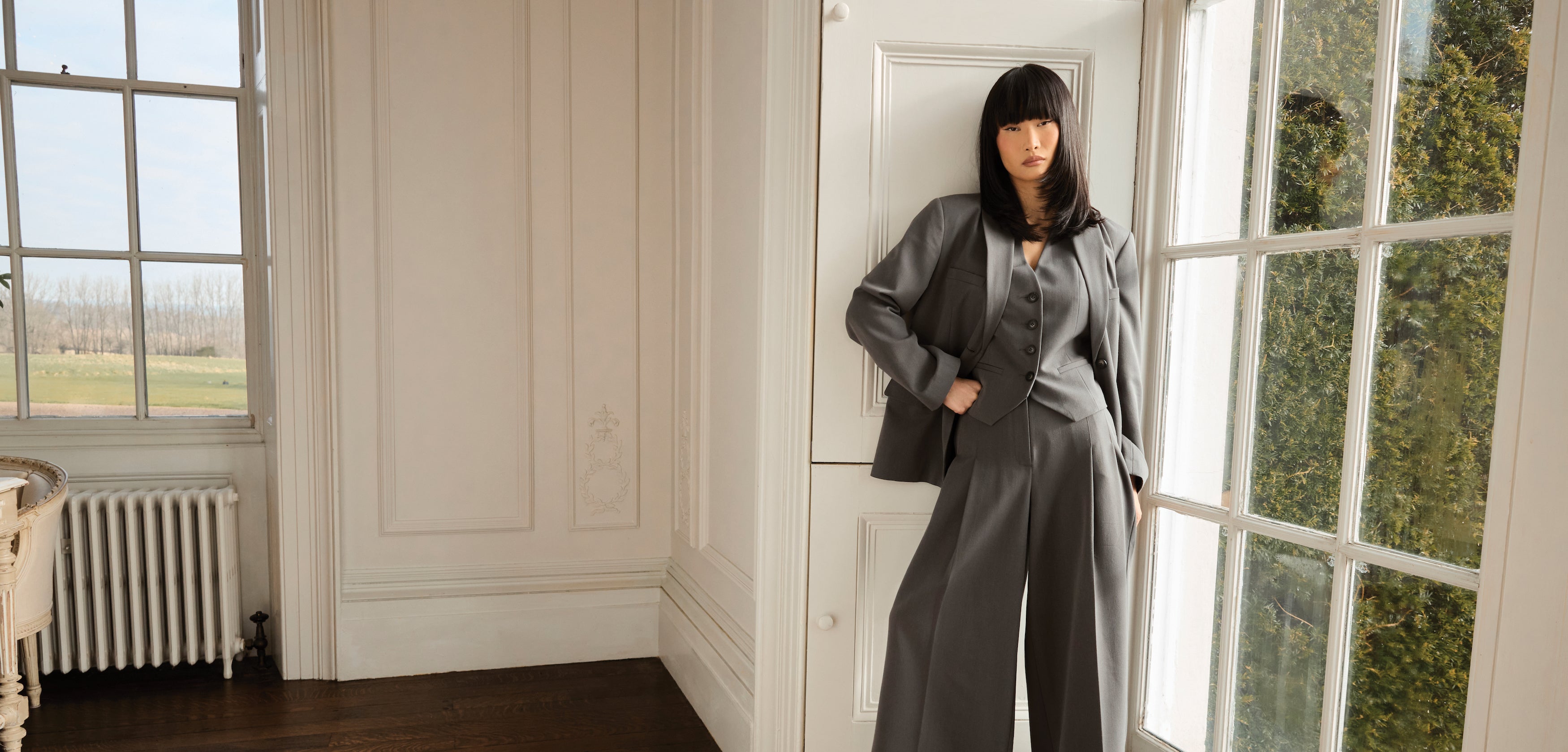 a woman leaning against a door