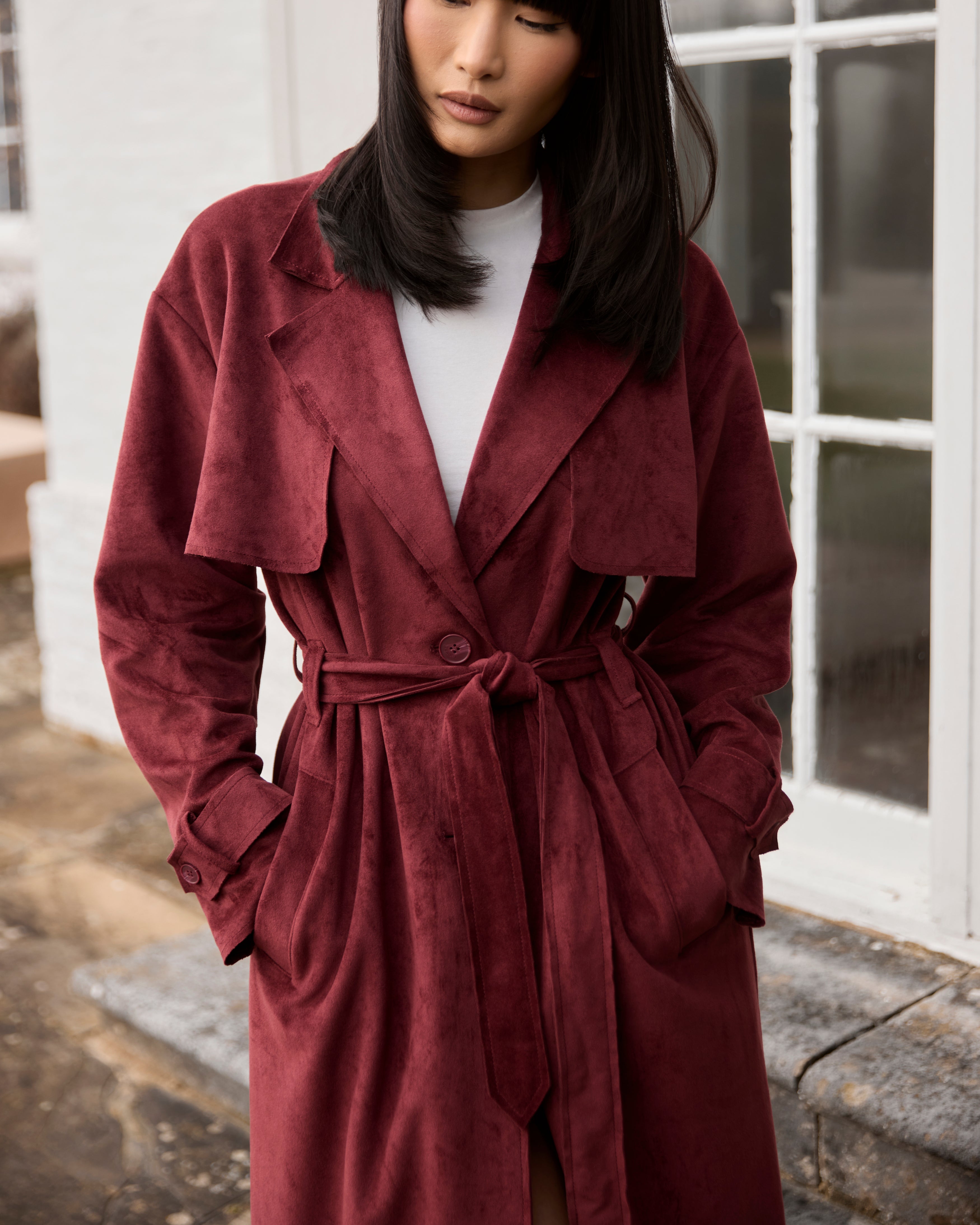 a woman in a red coat