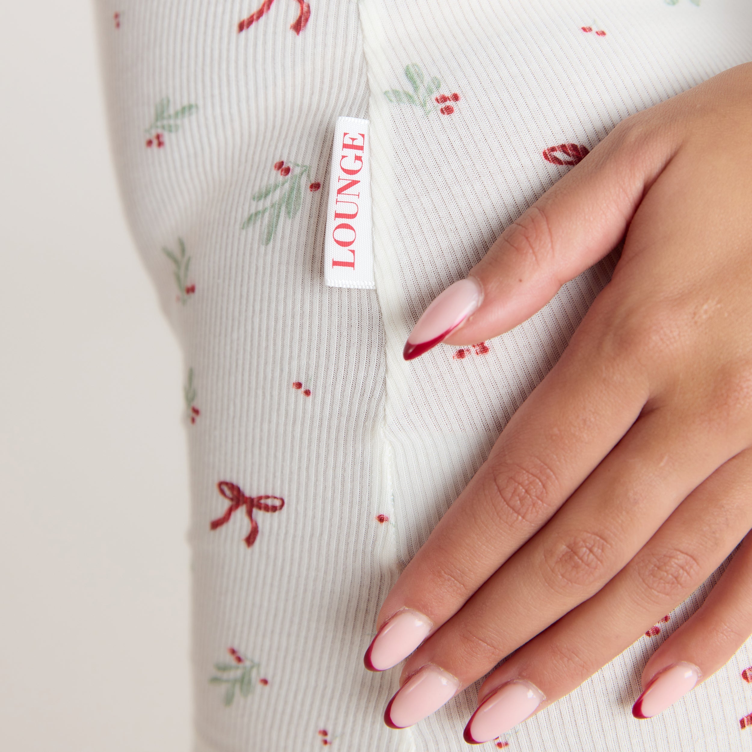 Mistletoe Ribbed Romper | Mistletoe Ribbed Romper - Bow Print