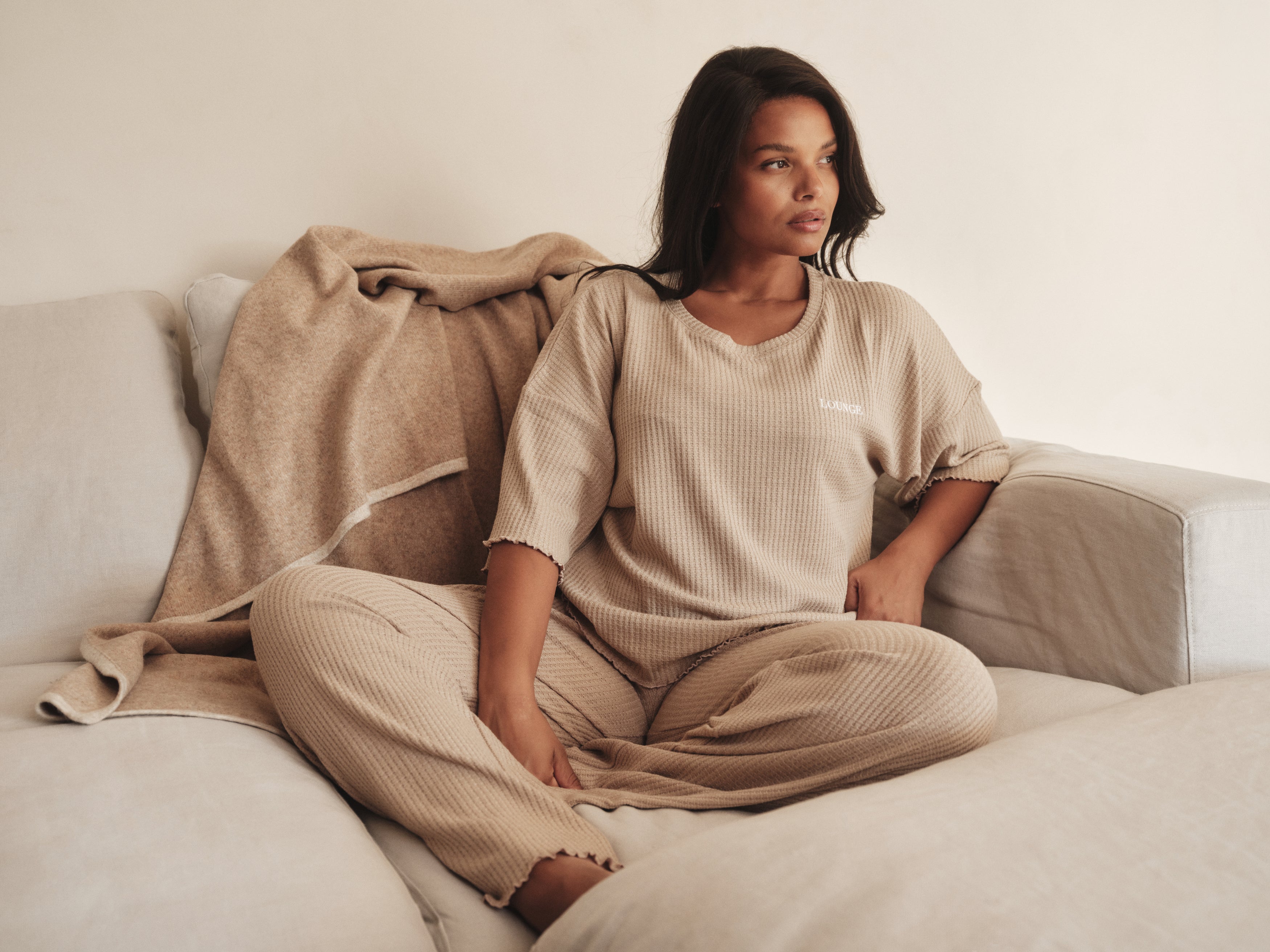 a woman sitting on a couch
