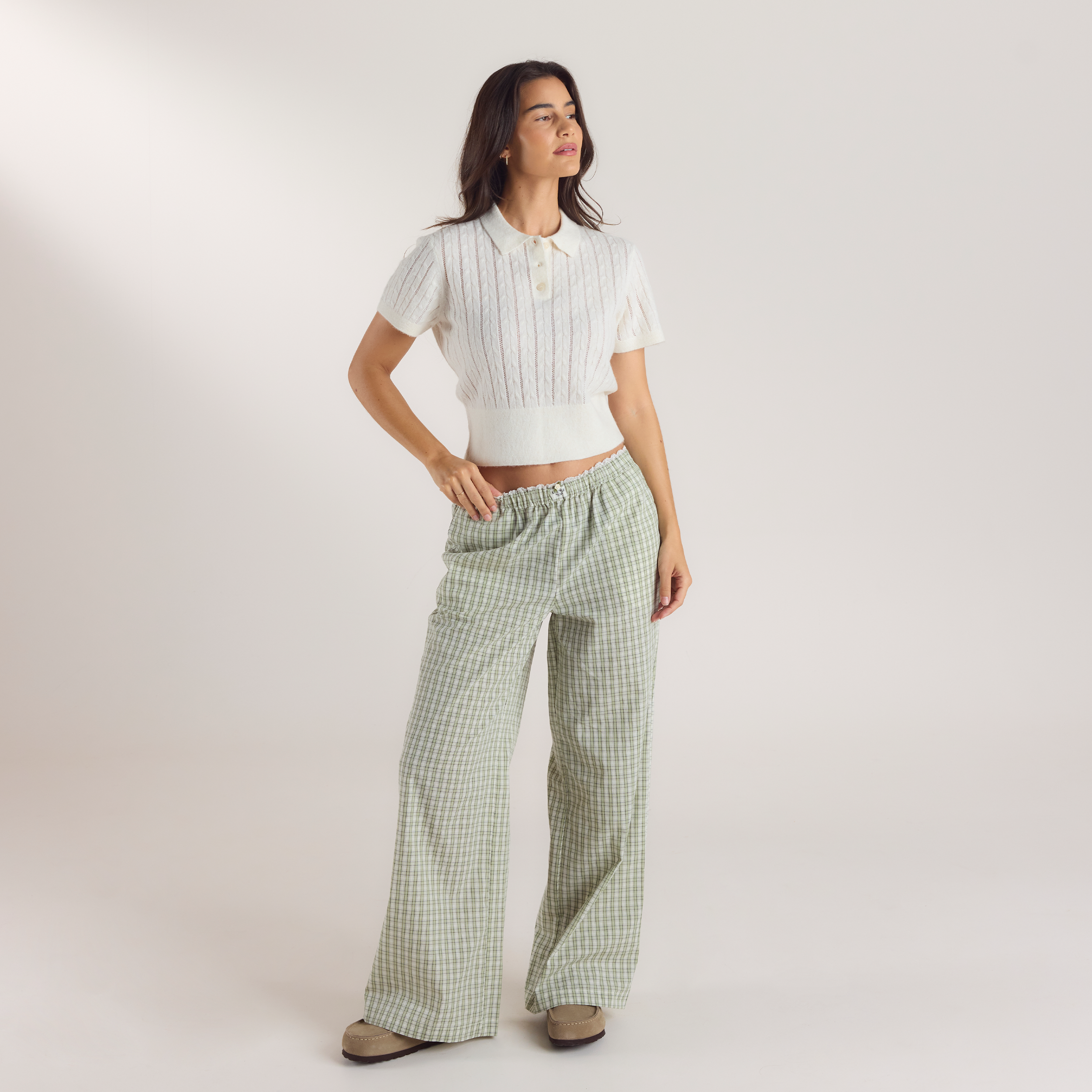 a woman in a white shirt and pants