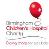 a red balloon with a white cross on it